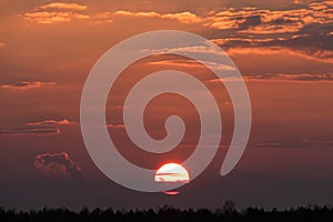 The sun setting over the vast plain.