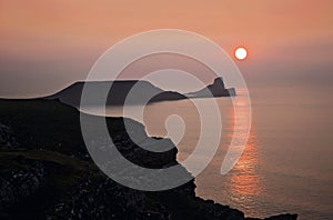 Sun Setting over Worms Head, Rhossili The Gower, South Wales