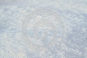 Sun shines on ground covered with snow - closeup macro detail