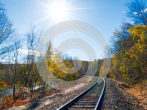 Sun shines over train tracks in Fall