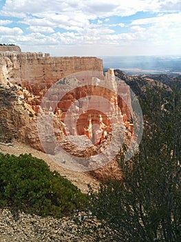 Sun shining on dramatic rock formations at Bryce Canyon National Park