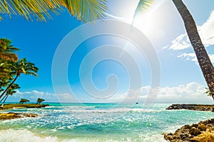 Sun shining over Bas du Fort beach in Guadeloupe