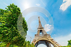 Sun shining over Effel tower in Paris