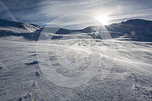 Sun over a slope in the ski resort Serfaus Fiss Ladis in the Autrian mountains