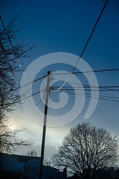 Sun shining on power lines in the evening..