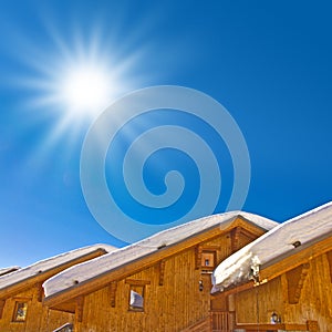 Sun shining, snowy roofs