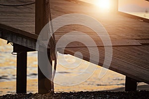 Sun shining on wooden pier