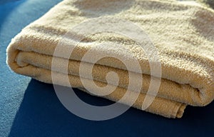 Sun shining on yellow bath towels