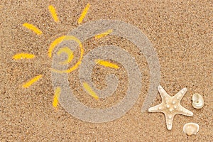 Sun sign drawn on sand and white tube of sunscreen. Template mockup for your design. Creative top view