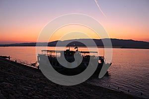 Two boats docked on the banks of the Irrawaddy north of Mandalay