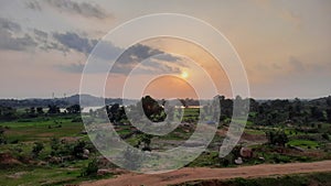 Sun sky trees grass road water