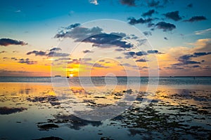 Sun slowly drops over key west water in Fl