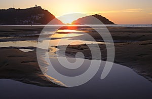 Sun at sunset in front of La Concha beach in the city of Donostia, San Sebastian, Euskadi