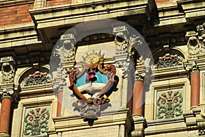 Sun symbol on the building wall