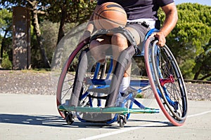 Sun-tanned man in sports wheelchair