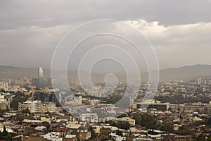 Sun trying pass through smog above the Tbilisi.