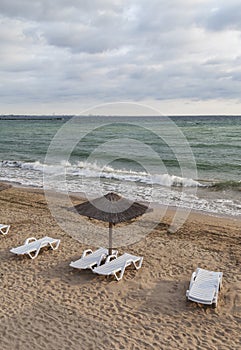 Sun umbrella on empty sea beach