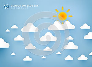 Sun and white clouds on pastel blue sky background design paper