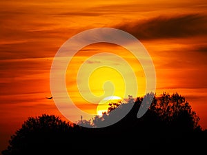 Sun with yellow band over lake ivars and vila sana, lerida, spain, europe