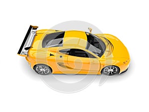 Sun yellow modern fast sports supercar - top down view