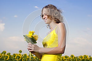 Sun young girl in the field with sunflowers