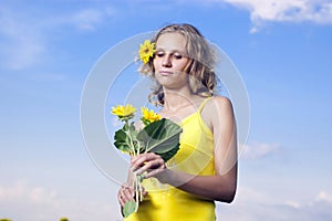 Sun young girl in the field with sunflowers