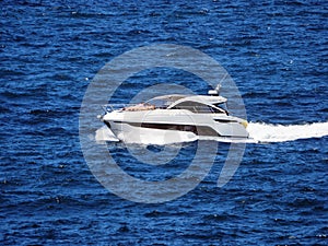 Sunbaking on Foredeck of Modern Sports Boat