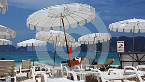 Sunbath chairs and deep blue sea