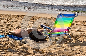 Sunbather on beach photo