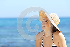 Sunbather dreaming looking at side on the beach photo