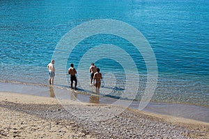 Sunbathers on a sandy beach