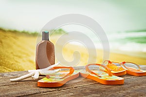 Sunbathing accessories placed on planks at the beach