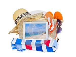 Sunbathing accessories with sea on tablet