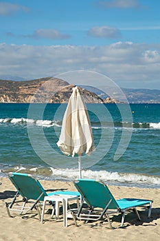 Sunbathing chairs on a beach in Greece