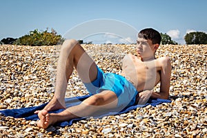 Sunbathing on a stoney beach