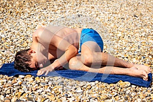 Sunbathing on a stoney beach