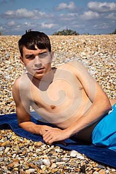 Sunbathing on a stoney beach