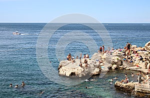 Sunbathing, swimming Adriatic sea, Rovinj, Croatia
