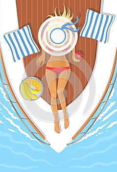 Sunbathing young woman on a boat