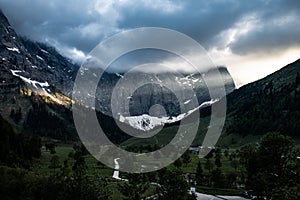 Sunbeam in the alps through an hole in the clouds