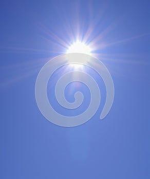 Sunbeam through the haze on blue sky, vertical