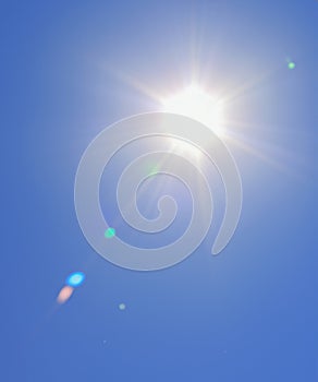 Sunbeam through the haze on blue sky, vertical