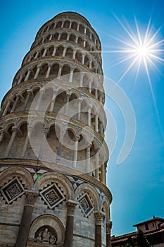 Sunbeams and the Leaning Tower of Pisa in Tuscany, Italy