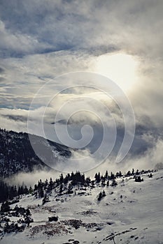 Sunbeams passing through clouds, winter landscape, Elbe valley, freezing weather