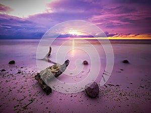 Sunbeams at sunset on the beach of Maratua Island, Borneo, Indonesia.jpg