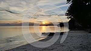 SunBeautiful Sunset on Sea Boat in White Sand Beach