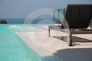 Sunbed with infinity pool