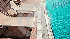 Sunbed. Summer resort chair, relax lounge at luxury hotel pool. Beach lounger chaise. Vacation sea rest sun tan concept.