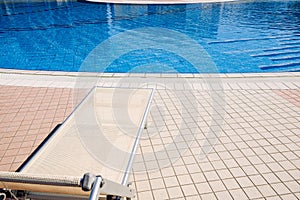 Sunbed. Summer resort chair, relax lounge at luxury hotel pool. Beach lounger chaise. Vacation sea rest sun tan concept.