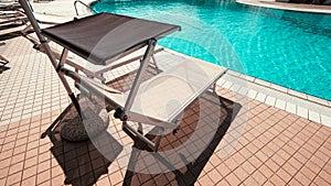 Sunbed. Summer resort chair, relax lounge at luxury hotel pool. Beach lounger chaise. Vacation sea rest sun tan concept.